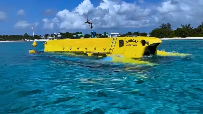 Yellow submarine in Grand Cayman waters during Submarine Tours exploring marine life.